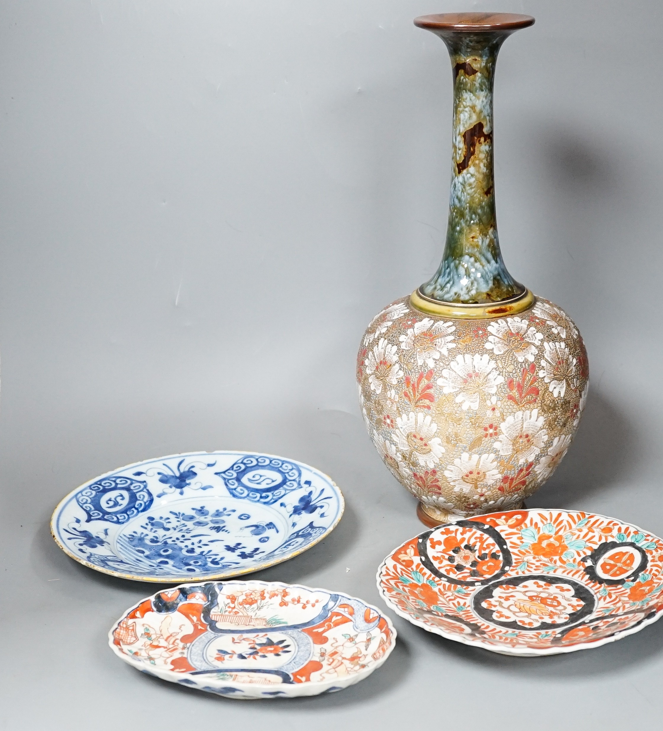 A Doulton slaters patent vase, height 40cm, two Imari dishes and an 18th century Delft blue and white plate